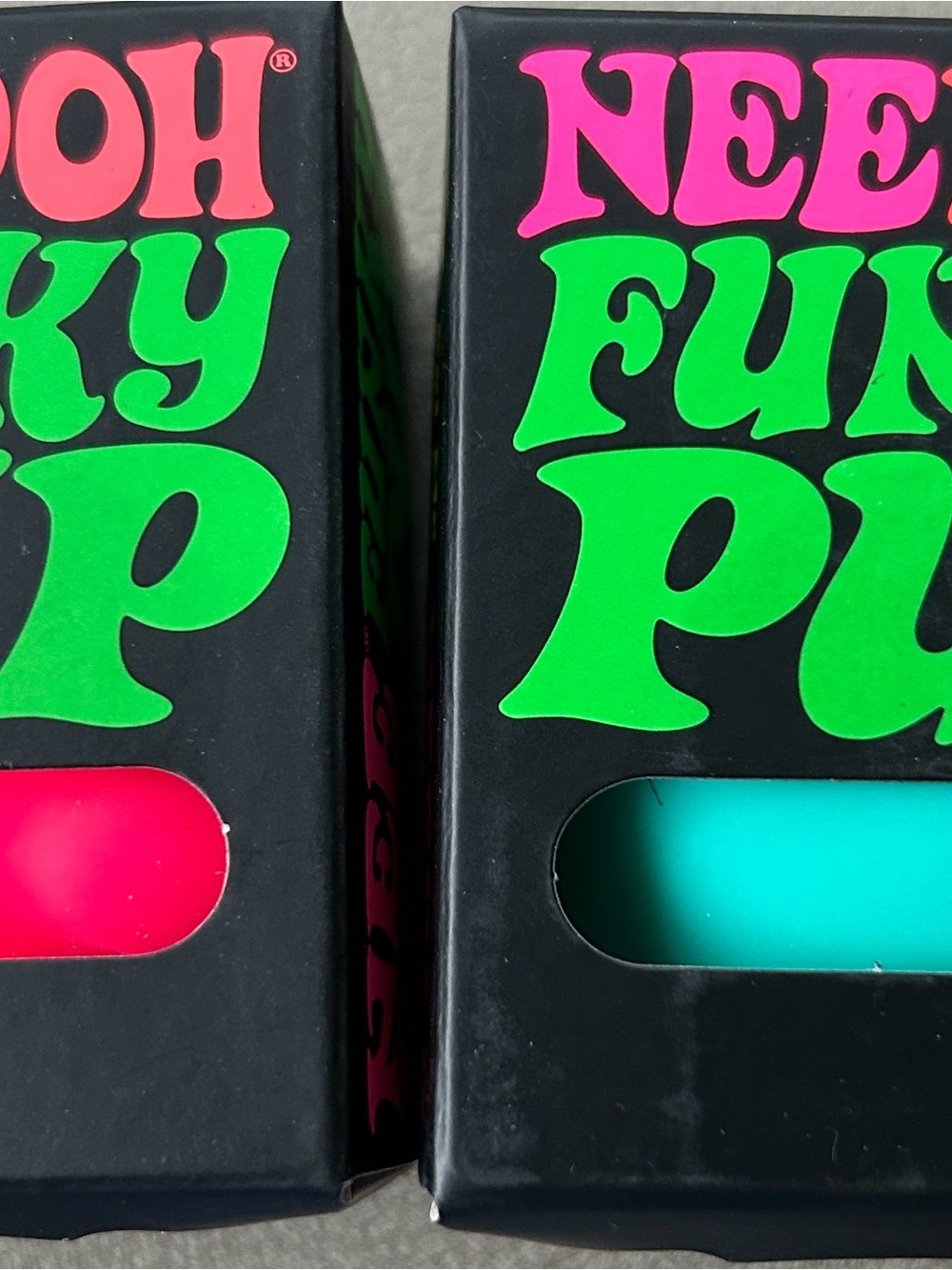 (2). Nee Doh Funk Pups.  pink and teal
